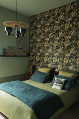 Bedroom with floral wallpaper, green bedspread, and decorative pillows. Grands Pavots Wallpaper 59B by Antoinette Poisson featuring a decorative French floral pattern inspired by historic domino papers. Callista Home