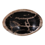 An oval-shaped petrified wood bowl with a glossy black interior and natural brown wood grain patterns, isolated on a white background. Callista Home