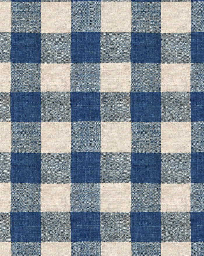 A close-up of a blue and off-white gingham checkered fabric pattern with a visible woven texture. Carreaux Indigo 84A blue geometric linen cotton fabric by Antoinette Poisson Callista Hme