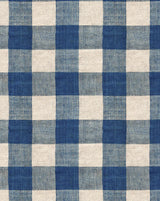 A close-up of a blue and off-white gingham checkered fabric pattern with a visible woven texture. Carreaux Indigo 84A blue geometric linen cotton fabric by Antoinette Poisson Callista Hme