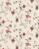 A repeating botanical pattern on a warm cream background, featuring pink flowers, green leaves, and small blue-green birds. Coromandel 85A French linen cotton botanical fabric by Antoinette Poisson Callista Home