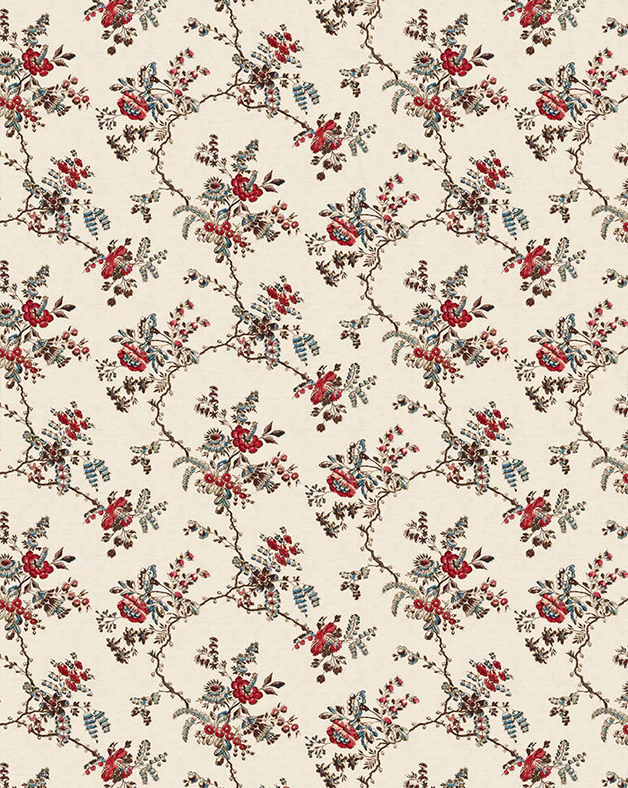 A repeating floral pattern on a warm cream background, featuring red flowers, muted blue leaves, and brown branches woven into a trellis-like design. Odile 86A French linen cotton decorative fabric by Antoinette Poisson Callista Home