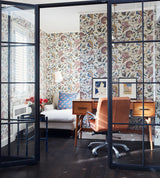 Modern office with patterned wallpaper, desk, and chair.  Jaipur 57A Indian-inspired botanical French wallpaper by Antoinette Poisson Callista Home