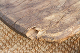 Close-up of a wooden surface with visible cracks and texture