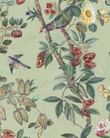 Vintage botanical fabric pattern featuring birds perched on branches with red berries, green leaves, and flowers on a muted sage green background. Canton 70B French Chinoiserie botanical fabric by Antoinette Poisson Callista Home