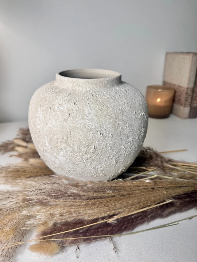 Hand-painted textured ceramic vase in an off-white linen wash finish with an organic sculptural design.