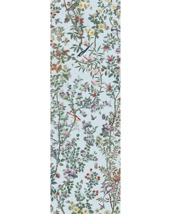 A narrow vertical panel showing a dense botanical and bird pattern on a pale blue background, with green leaves, pink and yellow flowers, and small birds and butterflies. Callista Home