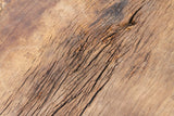 Close-up of a wooden surface with visible grain and texture