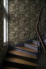 Staircase with ornate wallpaper featuring a floral pattern. Grands Pavots Wallpaper 59C by Antoinette Poisson featuring a large-scale French floral pattern inspired by historic 18th-century domino papers. Callista Home