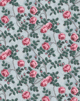 Floral pattern with pink roses and green leaves on a light blue background