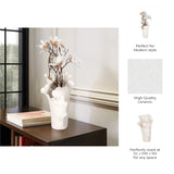 A white sculptural ceramic vase with a flared rim, shown holding dried white flowers on a dark wooden table in an interior setting. On the right, three text callouts describe the vase as suitable for modern style, high quality ceramic, and perfectly sized at 12L x 10W x 15H for any space. Callista Home