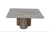 A square stone coffee table with rounded corners and three cylindrical pedestal legs, shown against a plain white background.  Callista Home