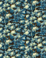 A close-up repeating pattern of dense blue and white flowering branches or foliage, filling the entire frame. Joli Bois 61 woodland botanical French wallpaper Callista Home