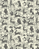 A repeating vintage-style botanical and animal print featuring owls, foxes, deer, birds, flowers, and leaves in dark charcoal gray on a warm cream background. Crépuscules 52B monochrome botanical French linen fabric CAllista Home