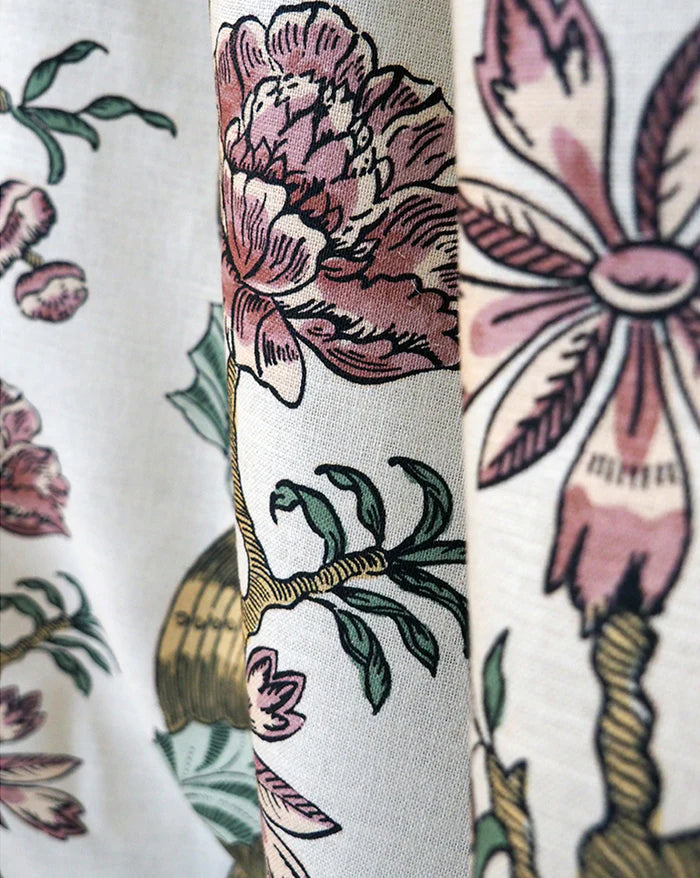 Close-up of a fabric panel featuring a vintage botanical print with pink peonies, green leaves, and gold-toned stems on a cream background. Fremch Fabric Callista Home