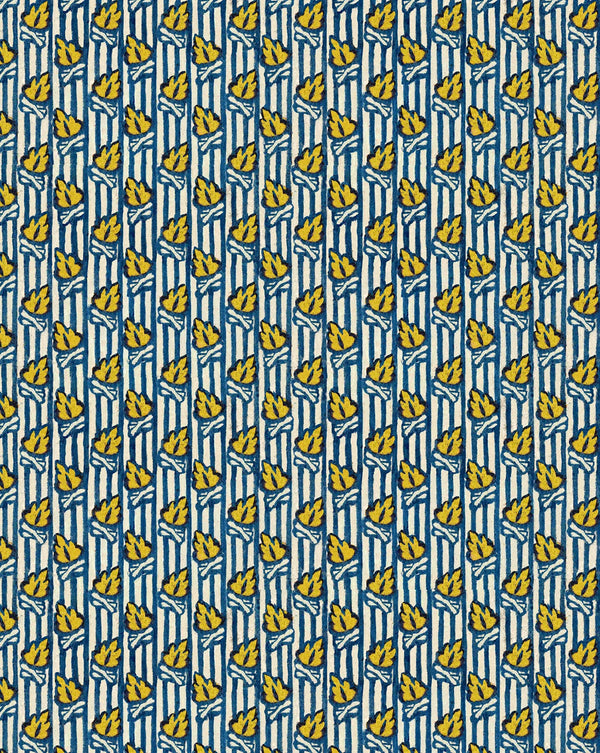 A repeating vertical pattern featuring yellow bananas on a blue and white striped background. Tison French linen furnishing and curtain fabric by Antoinette Poisson Callista Home